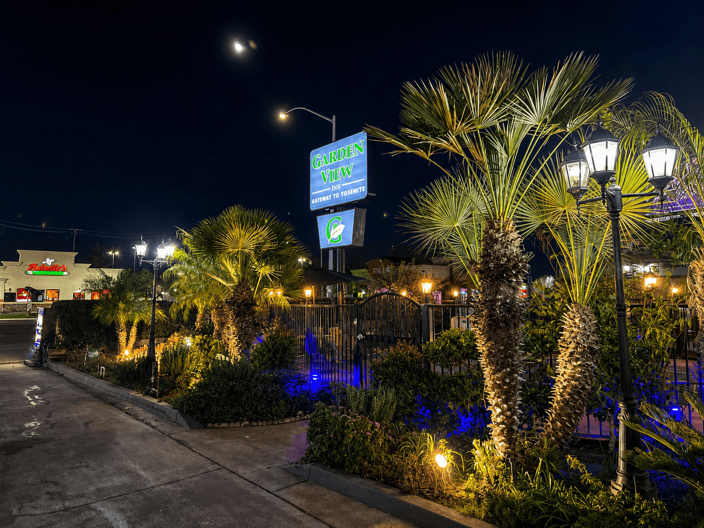 Garden View Inn property entrance and landscaping viewed from street