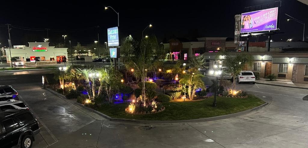 Garden View Inn illuminated courtyard and walkway at night