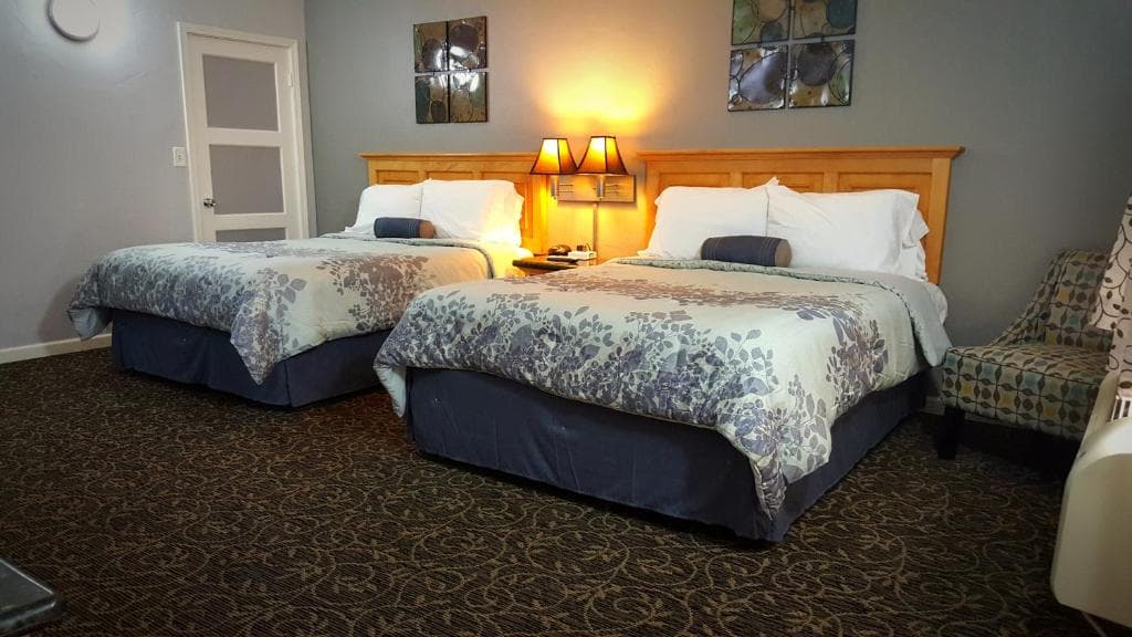 Guest room interior with two beds at Garden View Inn Fresno