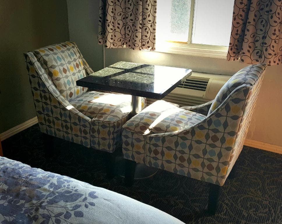 Clean guest room at Garden View Inn with neatly made beds