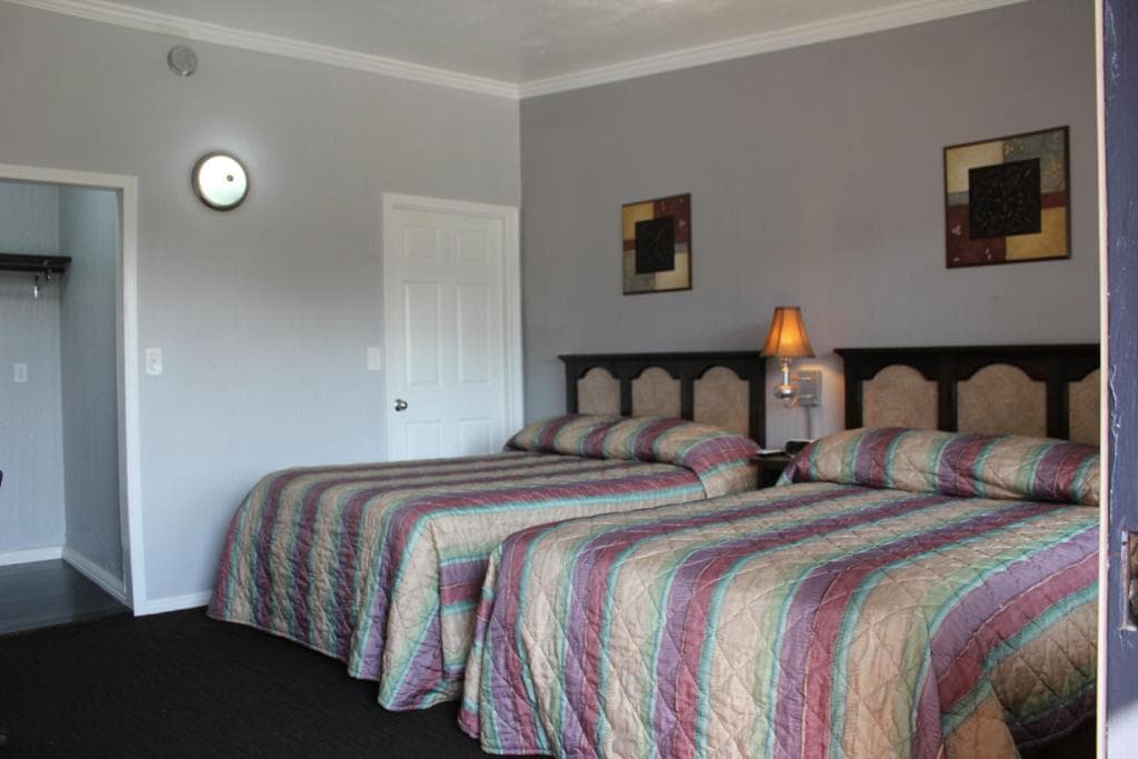 Deluxe Double Queen room with two beds at Garden View Inn